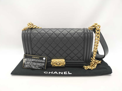 CHANEL Boy Black Lambskin Matelasse Shoulder Bag with Gold Hardware and Chain, 25 Series