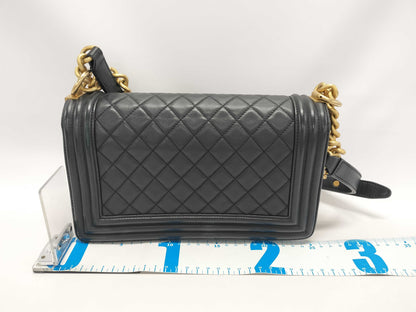 CHANEL Boy Black Lambskin Matelasse Shoulder Bag with Gold Hardware and Chain, 25 Series