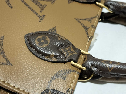 LOUIS VUITTON Monogram LOUIS VUITTON On the Go PM Tourtrell Creme Two-Tone Monogram Empreinte Leather Handbag