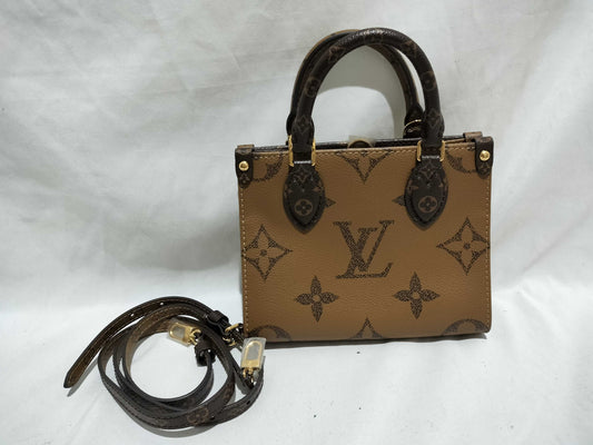 LOUIS VUITTON Monogram LOUIS VUITTON On the Go PM Tourtrell Creme Two-Tone Monogram Empreinte Leather Handbag