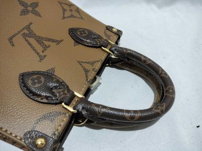 LOUIS VUITTON Monogram LOUIS VUITTON On the Go PM Tourtrell Creme Two-Tone Monogram Empreinte Leather Handbag