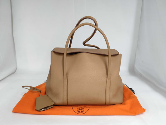 HERMES Initial Triyon Clemence Tabakcamel SS Bag