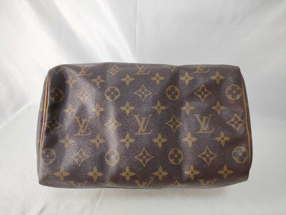 LOUIS VUITTON Monogram Louis Vuitton Speedy 25 Monogram Handbag