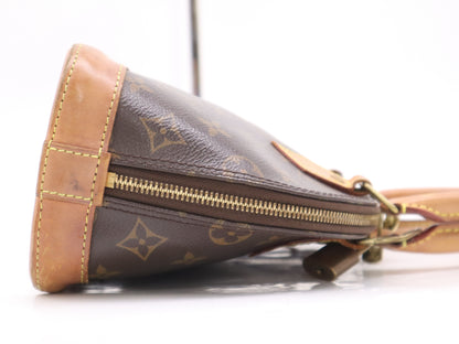 LOUIS VUITTON M53152 Monogram Alma BB Handbag with Shoulder Strap, Padlock, Two Keys, Cloche, and Dust Bag