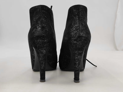 CHANEL Pearl-embellished short boots in black leather, size 37, with box and dust bag. Other shoes.