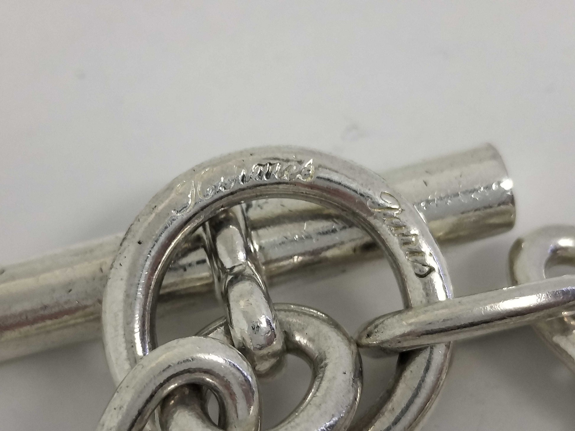 HERMES Schone Dunkle 4 Charms Cursive 16 Frames 79.8g Bracelet Bangle