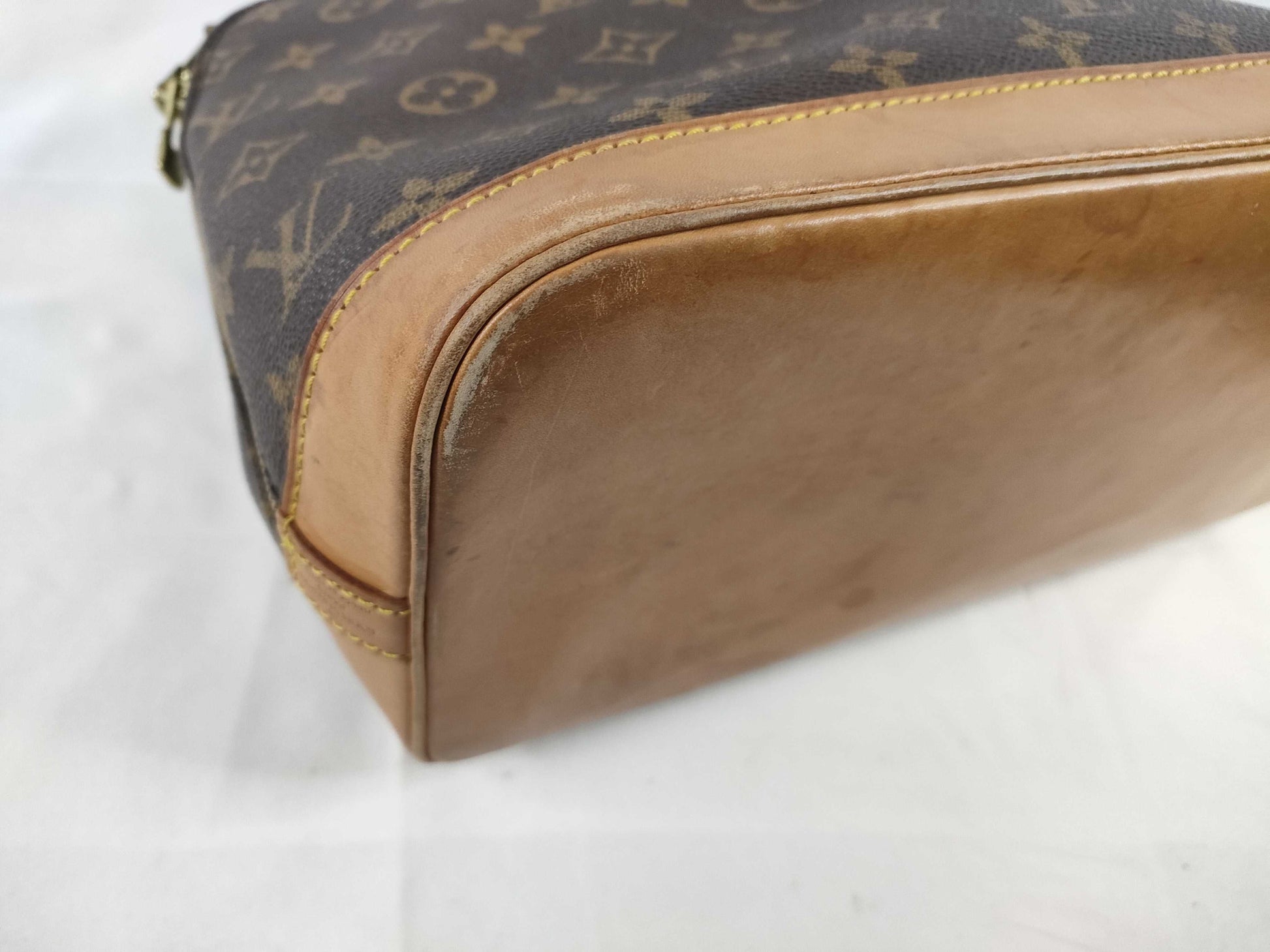 LOUIS VUITTON Monogram Alma Handbag