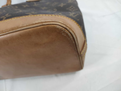 LOUIS VUITTON Monogram Alma Handbag