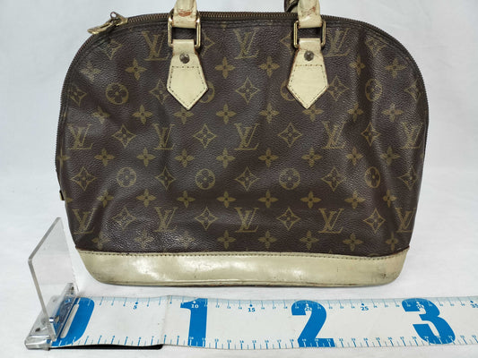 LOUIS VUITTON Monogram Alma Handbag