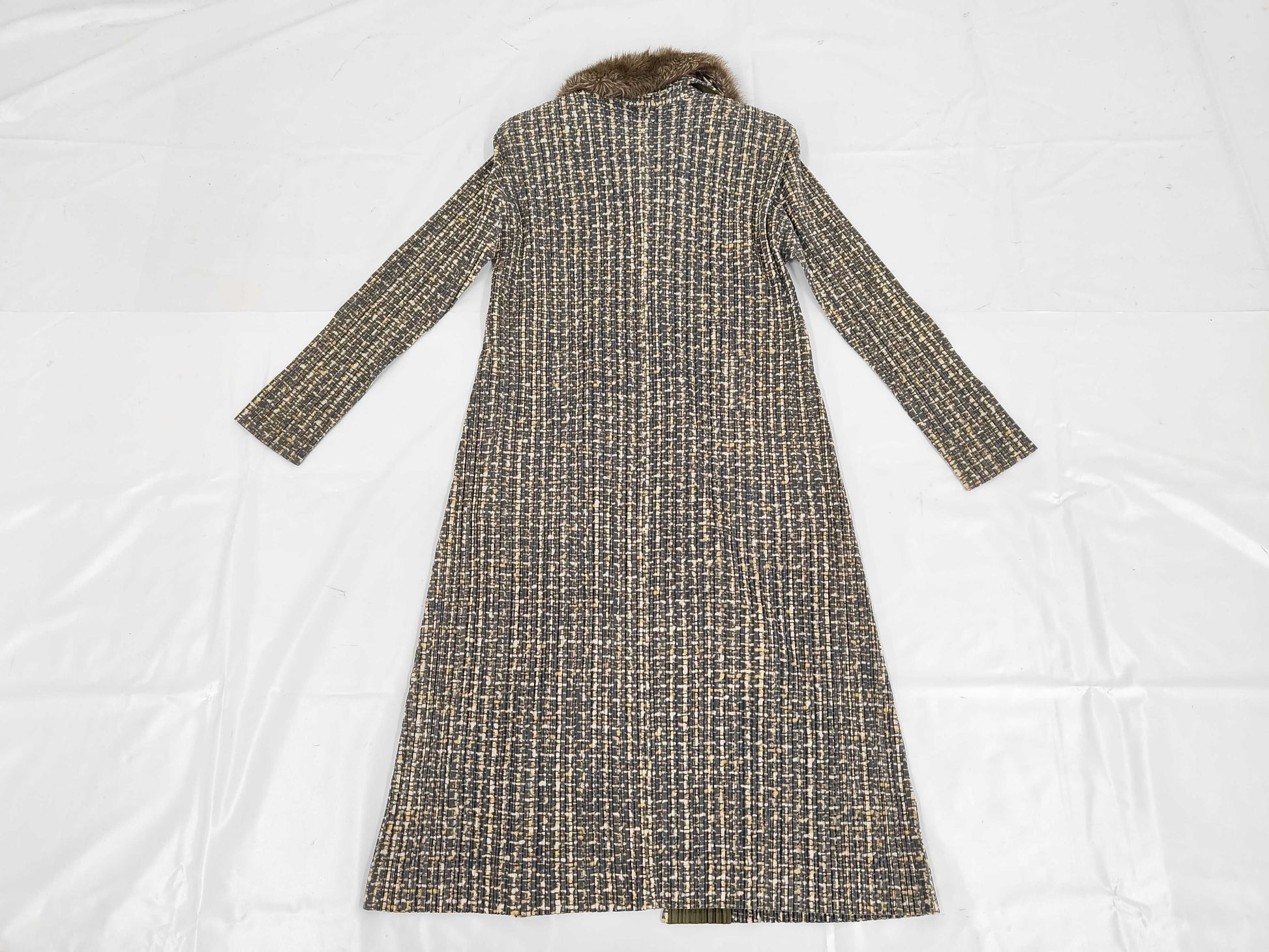 PLEATS PLEASE Issey Miyake long coat with fur collar and shoulder pads, all-over print