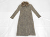 PLEATS PLEASE Issey Miyake long coat with fur collar and shoulder pads, all-over print