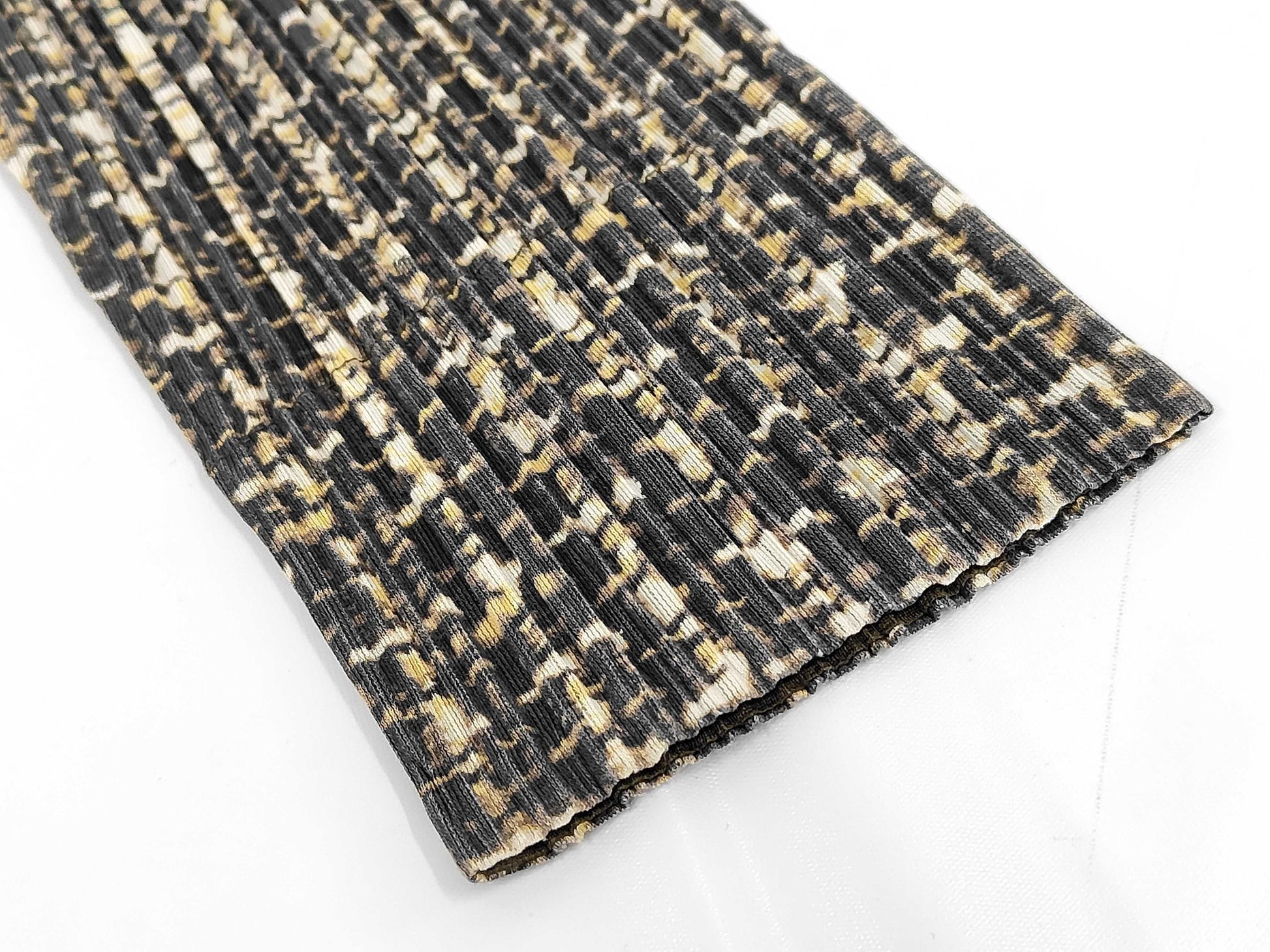 PLEATS PLEASE Issey Miyake long coat with fur collar and shoulder pads, all-over print