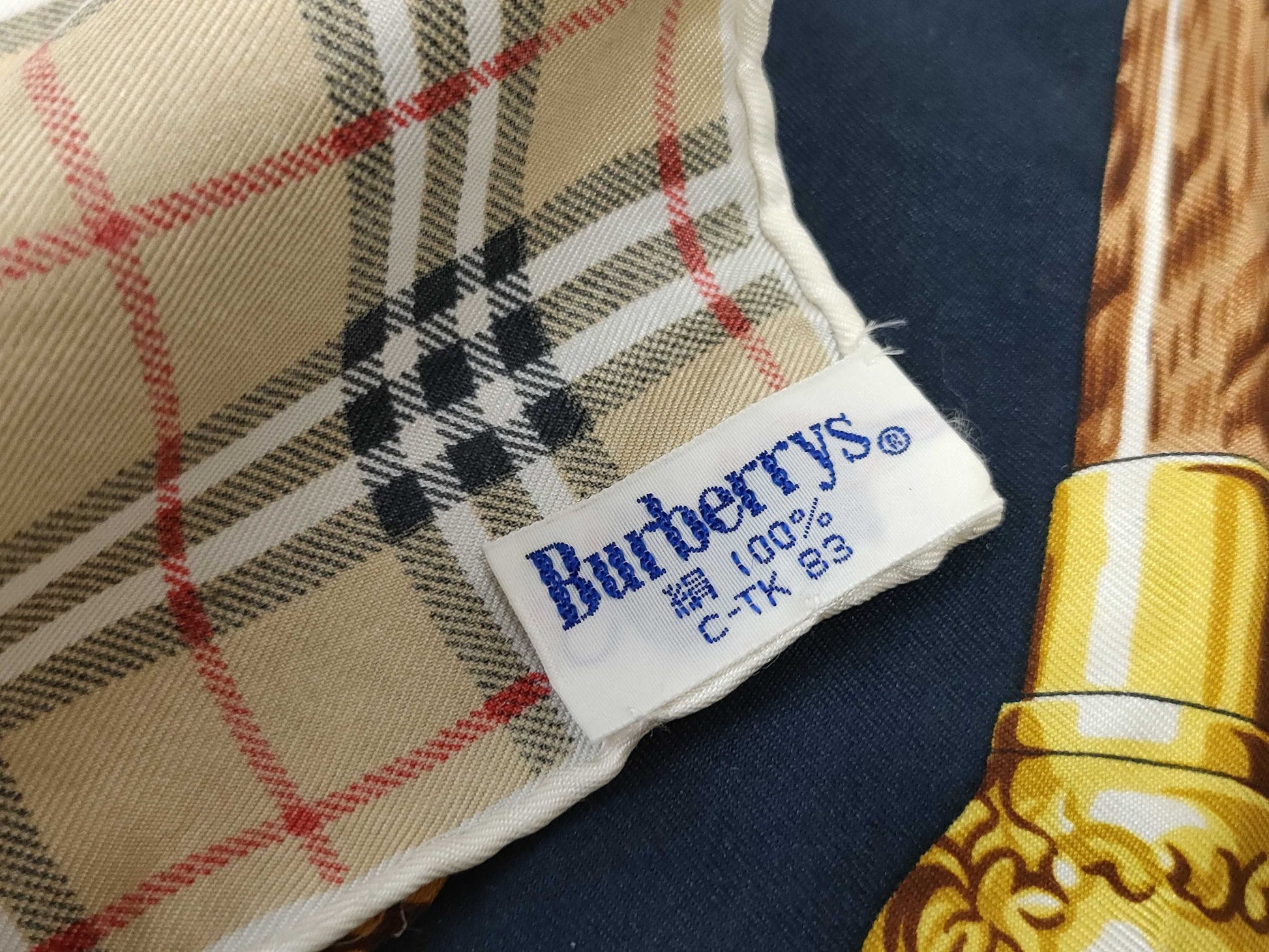 Burberrys all-over print silk scarf in beige and navy