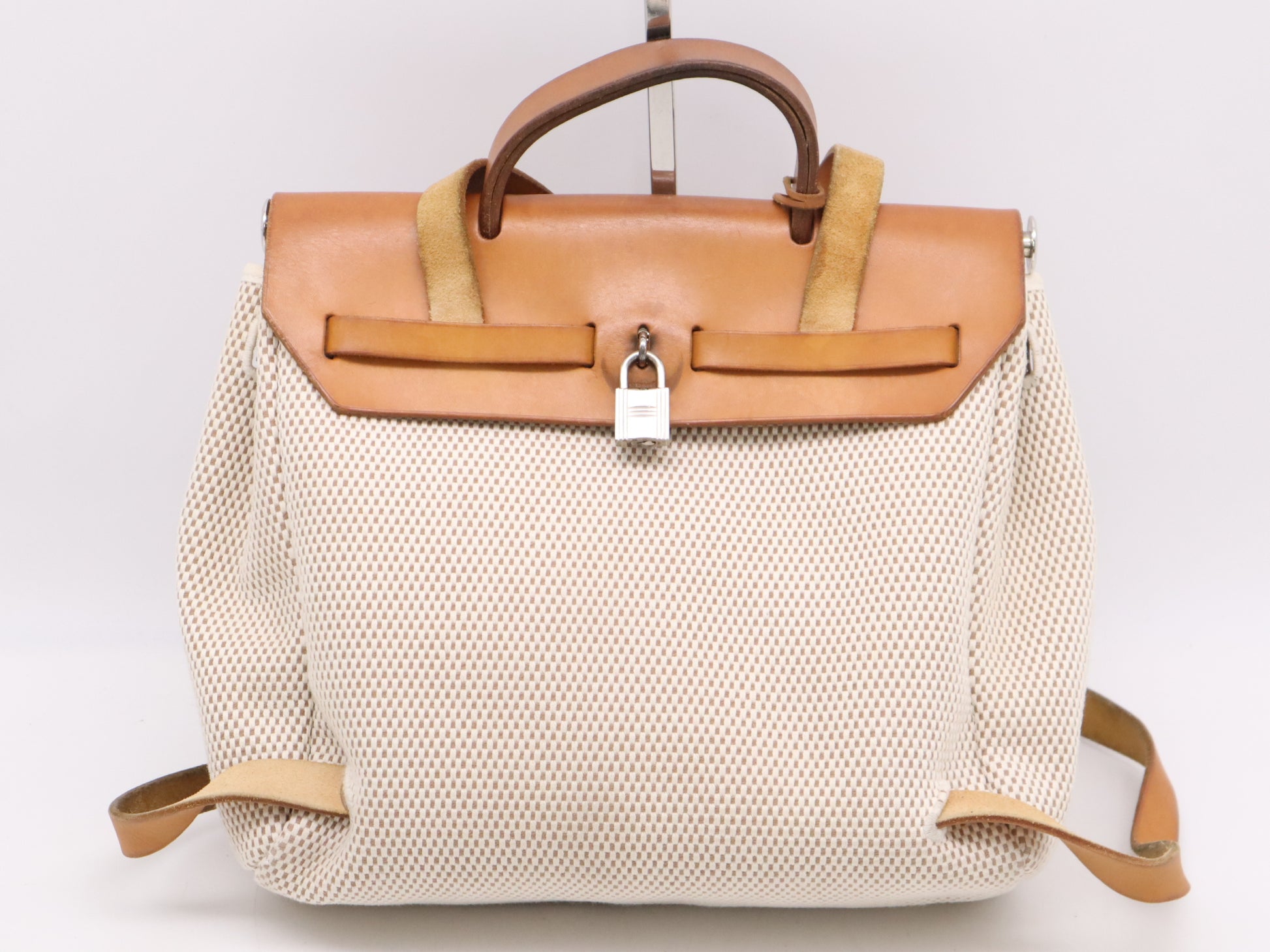 HERMES Toile GM x Leather Air Bag Ad PM Backpack in Brown, Beige, and Natural. Includes a padlock, two keys, a dust bag, and a box. H stamped. 2004.