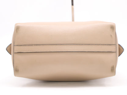 PRADA 2-way leather handbag in beige with GD hardware, shoulder strap, and clochette.