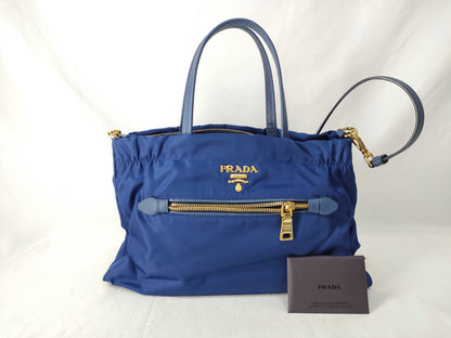 PRADA Prada Logo Testo Nylon/Saffiano Leather Handbag in Blue