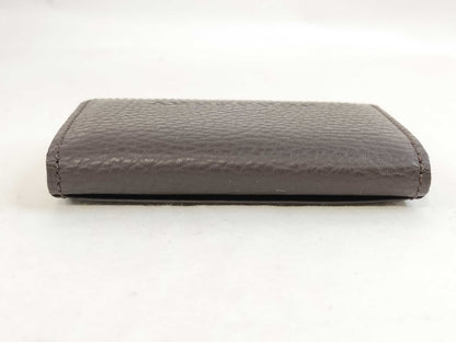 BURBERRY 18. Two Burberry clutches and a second bag