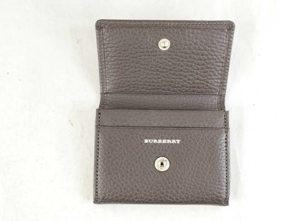 BURBERRY 18. Two Burberry clutches and a second bag