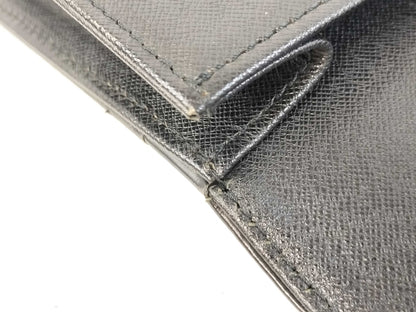 BURBERRY 18. Two Burberry clutches and a second bag