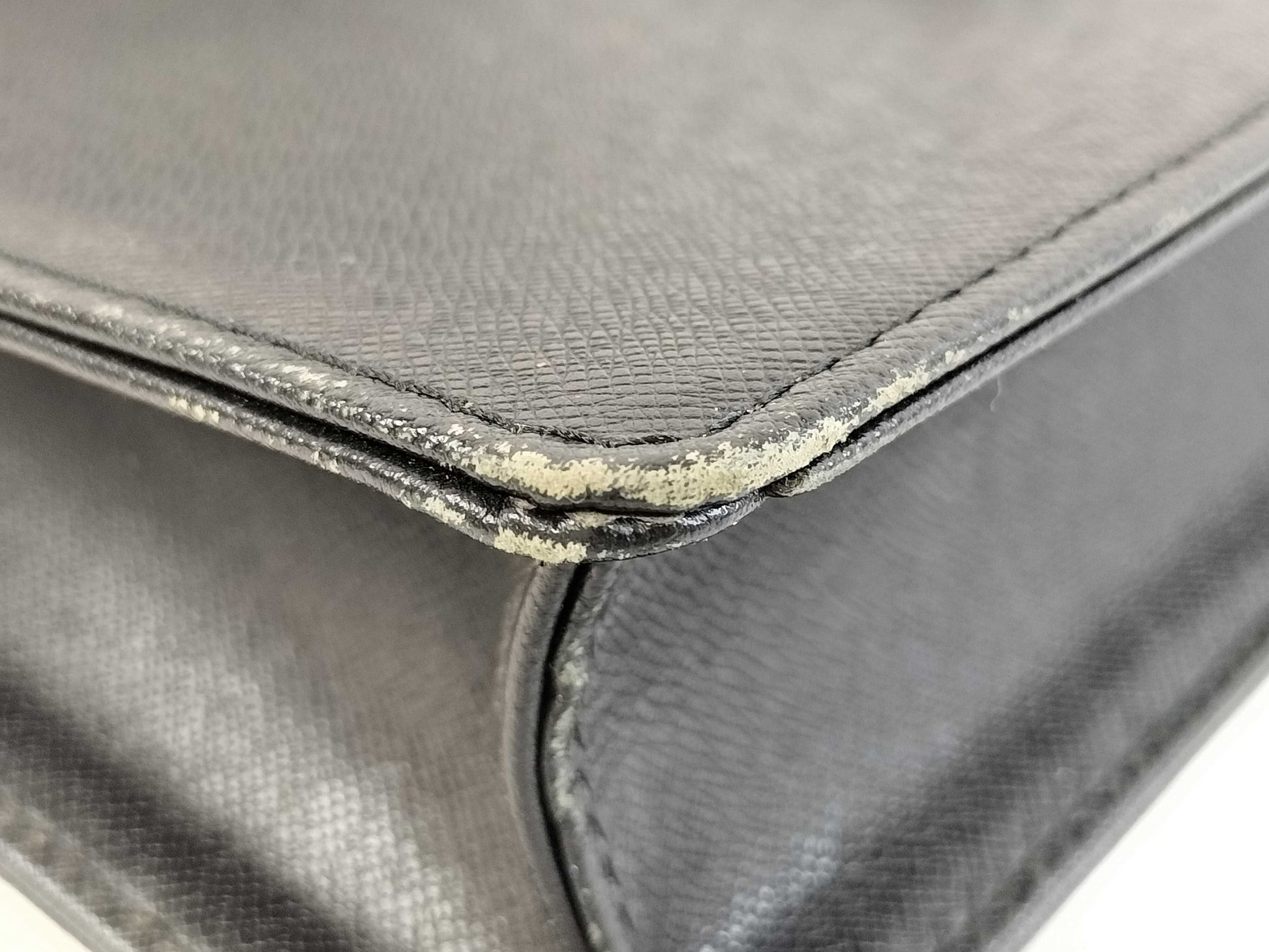 BURBERRY 18. Two Burberry clutches and a second bag