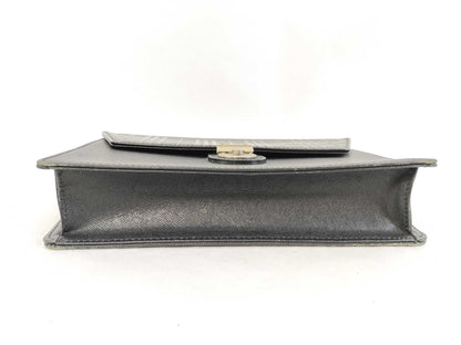 BURBERRY 18. Two Burberry clutches and a second bag