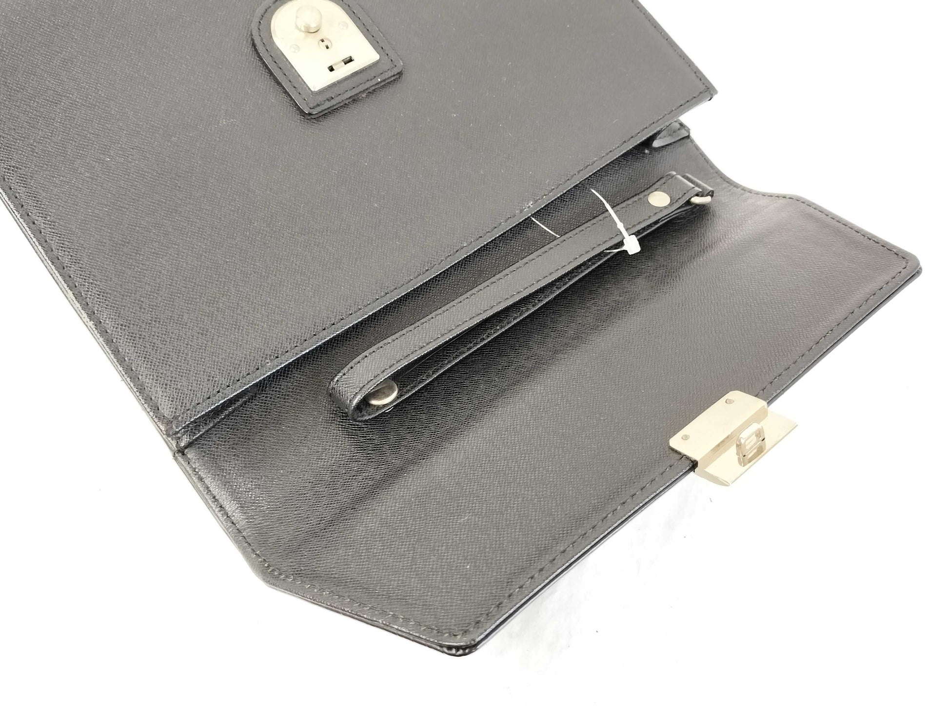 BURBERRY 18. Two Burberry clutches and a second bag