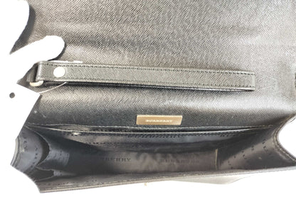 BURBERRY 18. Two Burberry clutches and a second bag