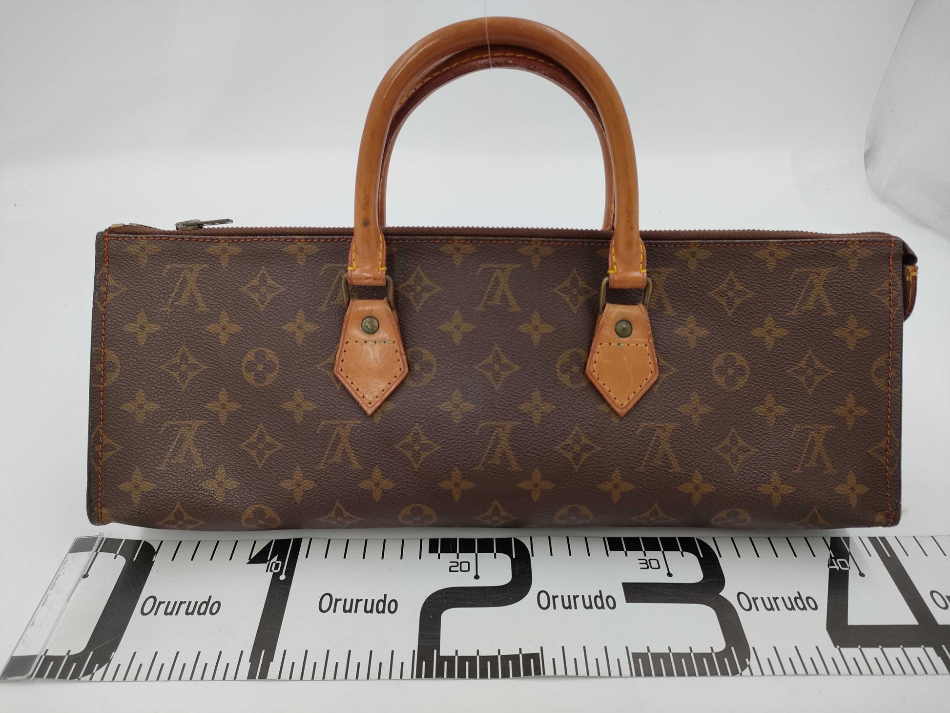 LOUIS VUITTON Monogram Sac Triangle Handbag