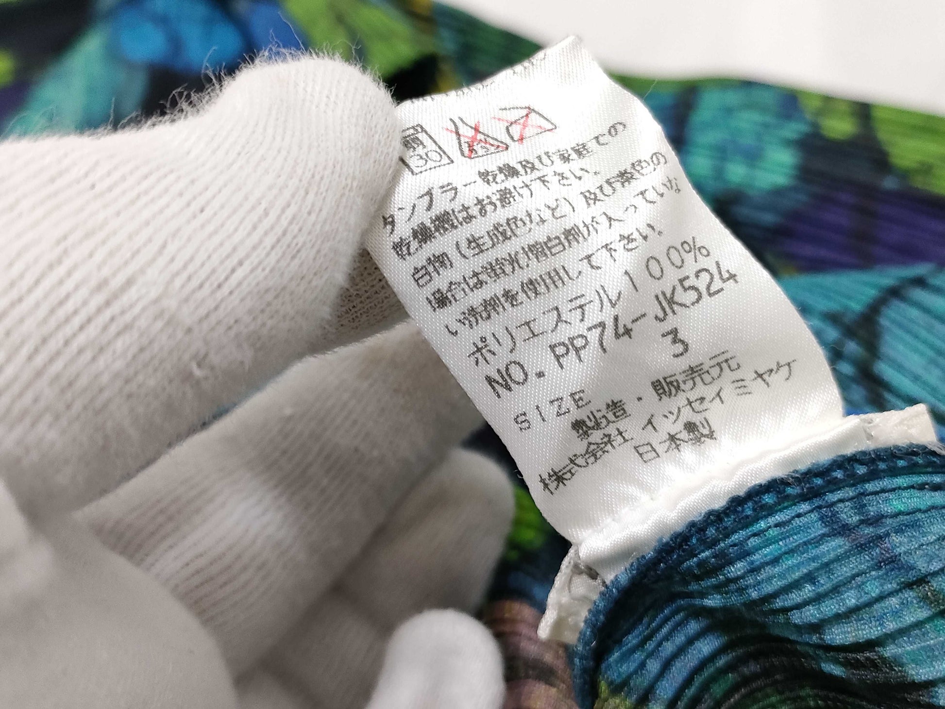 ISSEY MIYAKE Pleated Top with Patterned Buttons