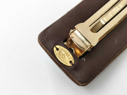 CHANEL Turnlock Suede Barrette Hair Accessory