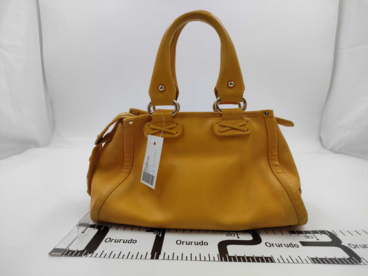CELINE Leather Handbag with Macadam Logo, Yellow