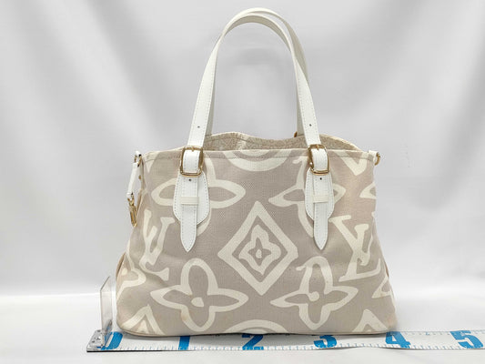 LOUIS VUITTON Taisienne PM Handbag with Stain