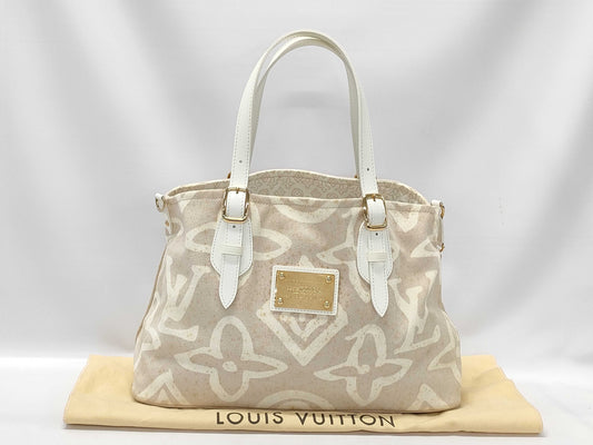 LOUIS VUITTON Taisienne PM Handbag with Stain