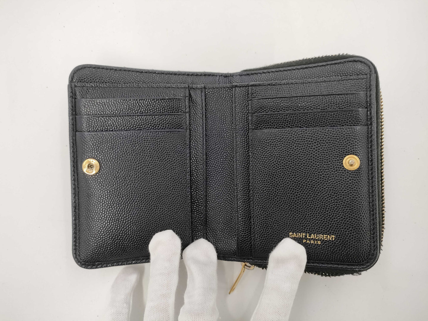 Yves Saint Laurent Bifold Wallet with Caviar, Gold Hardware, Logo, and a Tear