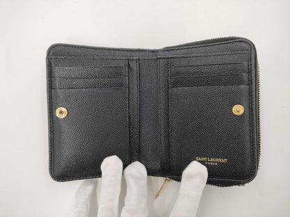 Yves Saint Laurent Bifold Wallet with Caviar, Gold Hardware, Logo, and a Tear