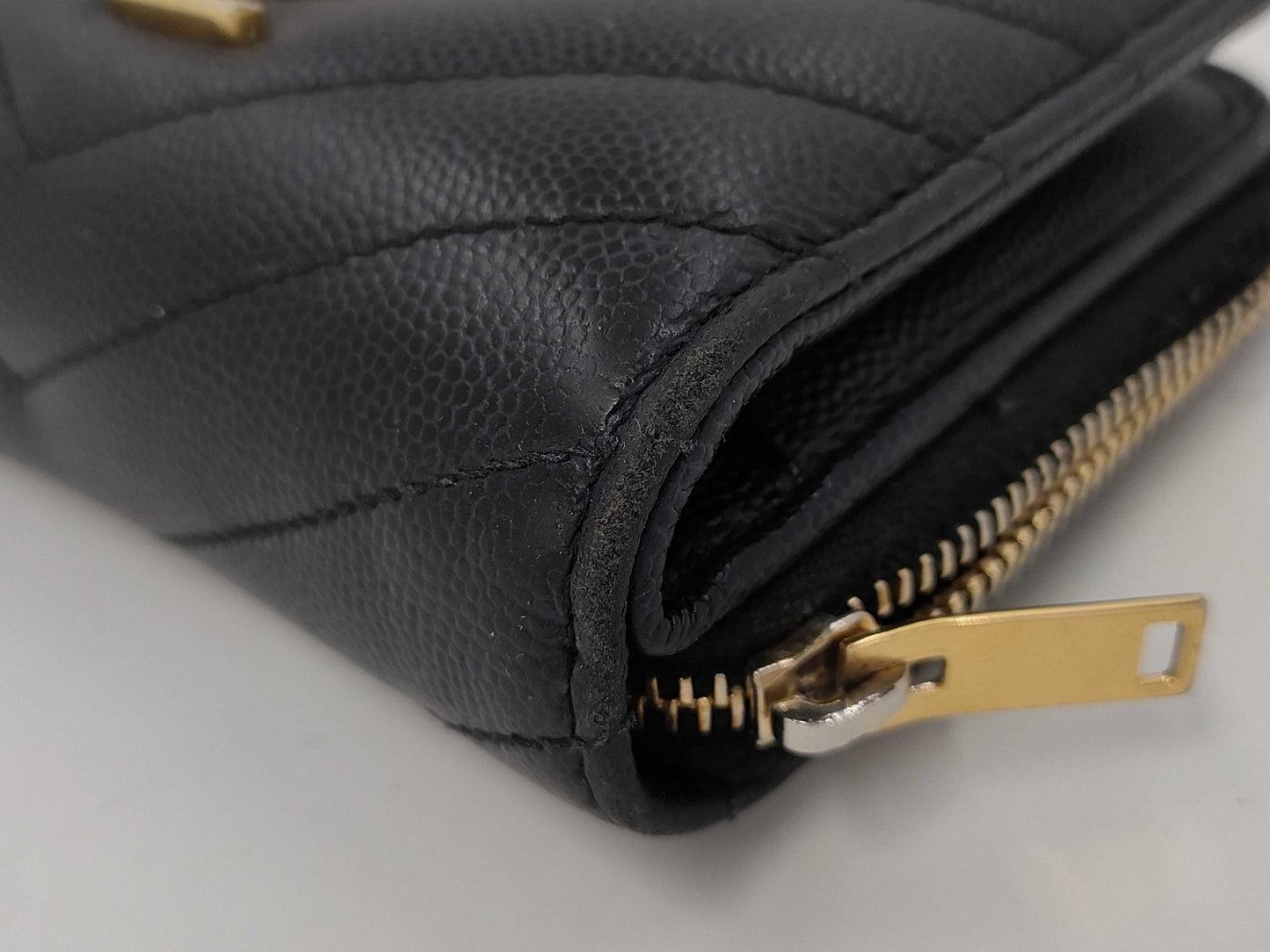 Yves Saint Laurent Bifold Wallet with Caviar, Gold Hardware, Logo, and a Tear