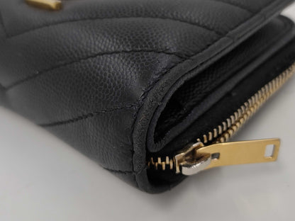 Yves Saint Laurent Bifold Wallet with Caviar, Gold Hardware, Logo, and a Tear