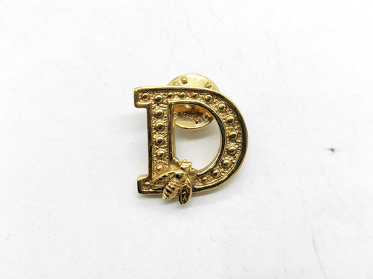 Dior logo brooch