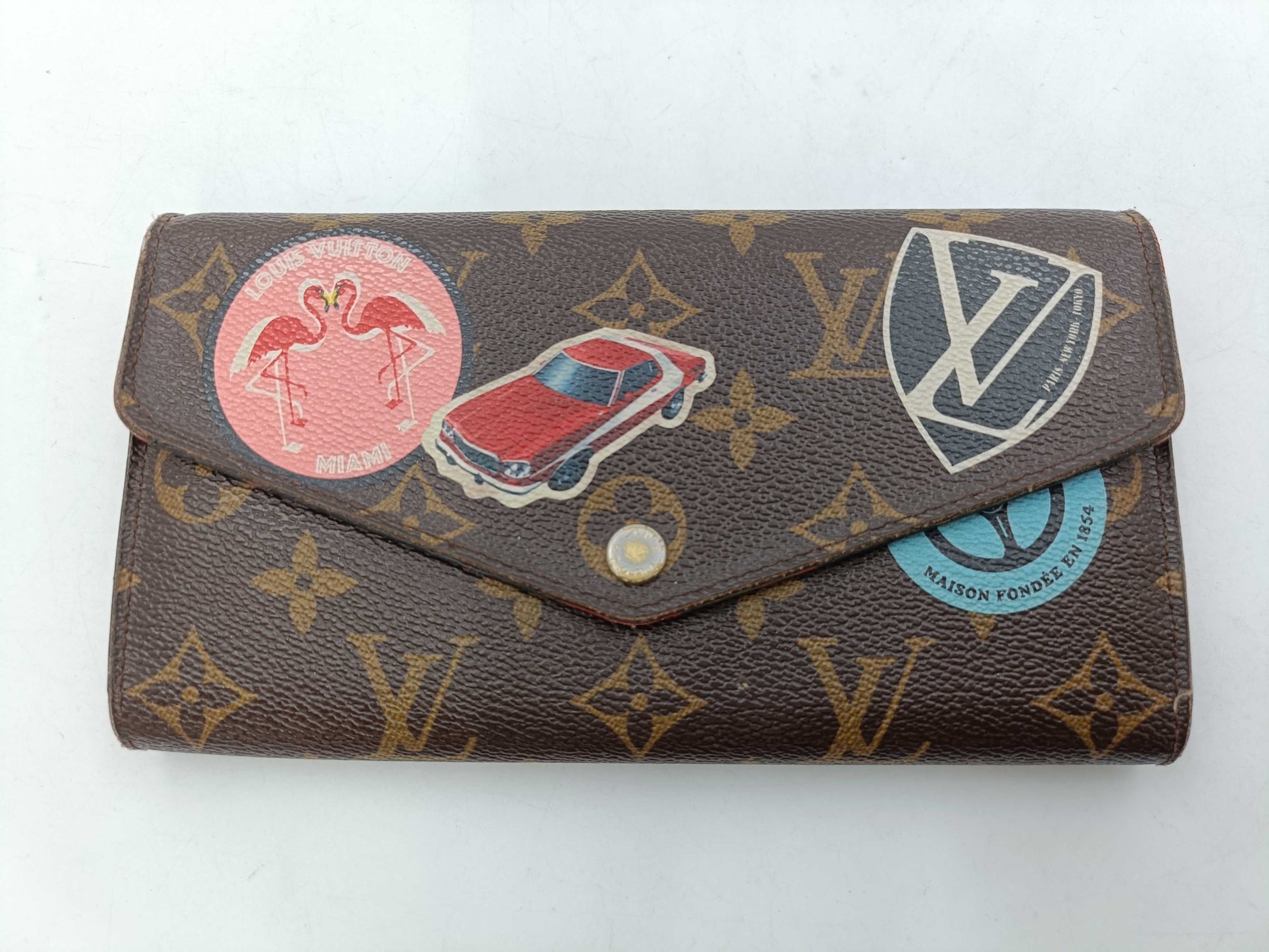 LOUIS VUITTON Monogram World Tour Portefeuille Sarah Wallet with Initials