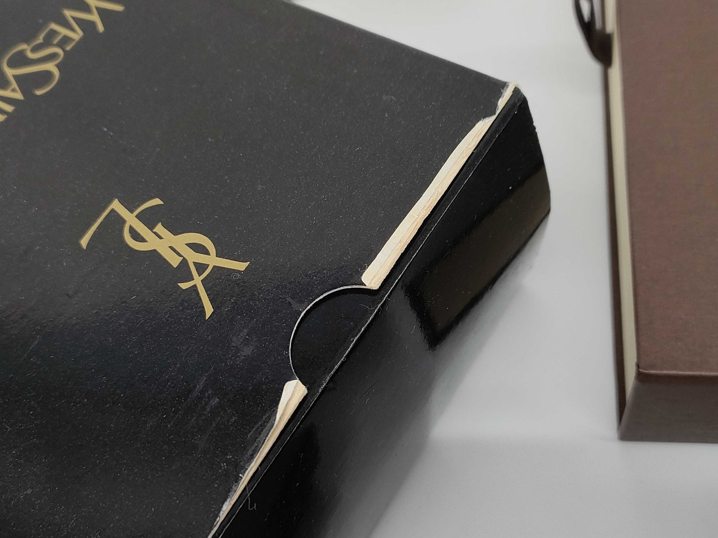 Empty Louis Vuitton, Gucci, Chanel, Loewe, and other brand-name boxes and dust bags. One M-tiered box. Empty brand-name boxes.