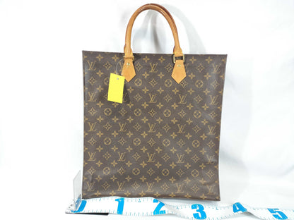 LOUIS VUITTON Monogram Sack Plastic Handbag