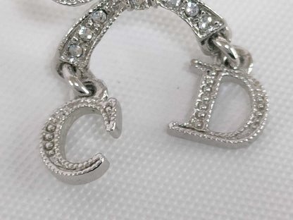 Dior CD logo ribbon rhinestone earrings