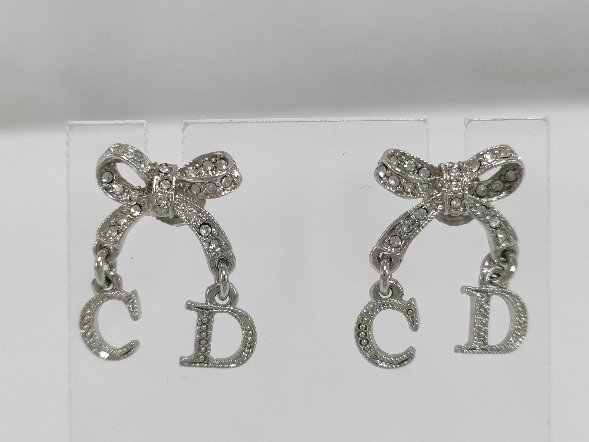 Dior CD logo ribbon rhinestone earrings