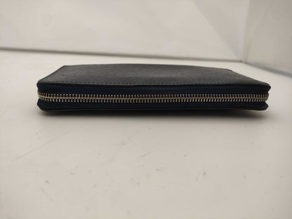 LOUIS VUITTON Taiga Zippy Vertical Wallet