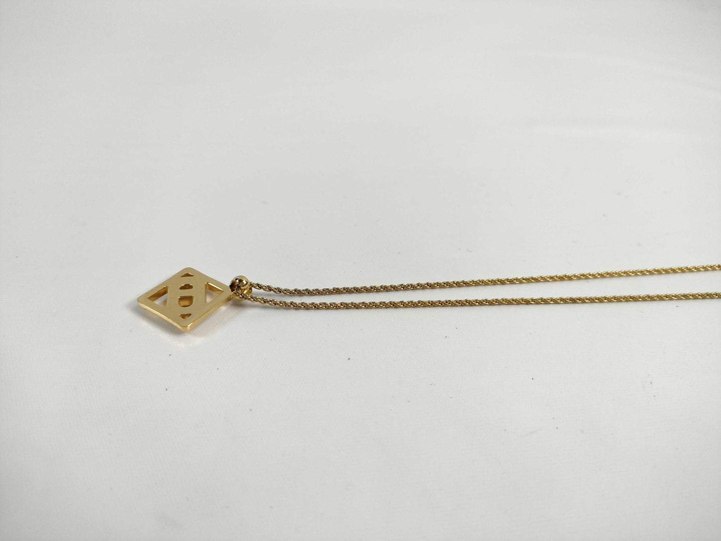 Dior logo necklace with stone and gold accents