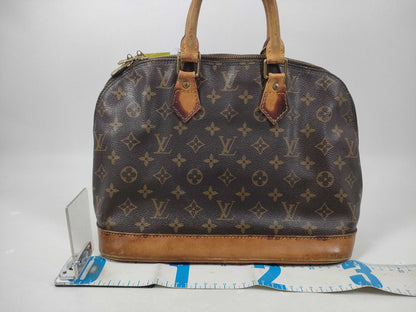 LOUIS VUITTON Monogram Alma Handbag